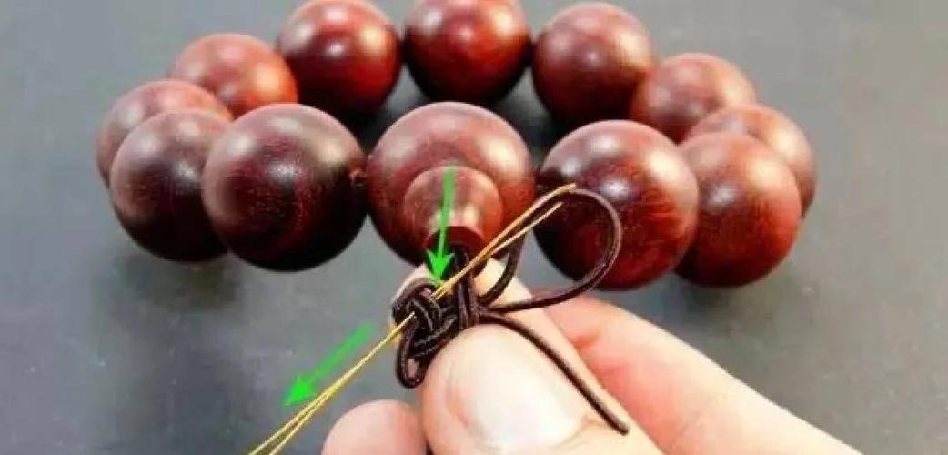 穿手串中间的隔结怎么打