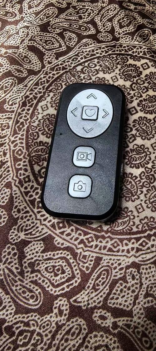 蓝牙手机拍照遥控器怎么用